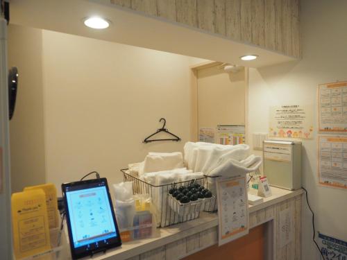 bnb+ Akihabara (Female Only) tesisinde bir odada yatak veya yataklar