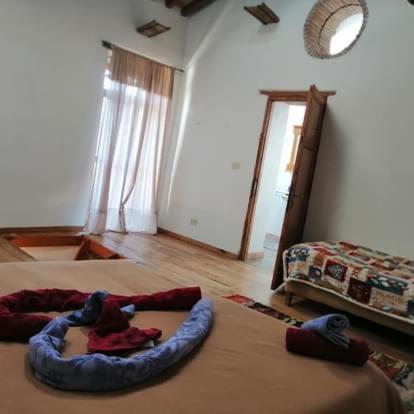 a bedroom with two beds with a teddy bear on it at Casa Bosco in San Polo