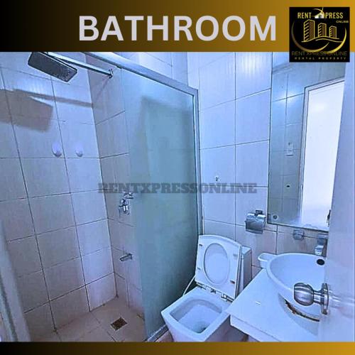 a bathroom with a toilet and a sink at FREE SAUNA & POOL ACCESS PLUS 70 PERCENT LESS PROMO This Month Affordable And Cheapest Deluxe Unit In Manila with Balcony x Near NAIA Airport x Manila Bay x Robinsons Place Ermita x Pgh x Bellagio x UP x Intramuros x Updated 2024 Price Staycation in Manila