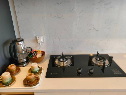 a stove top with two burners on a counter at 902 Hareta Serviced Apartment in Phnom Penh