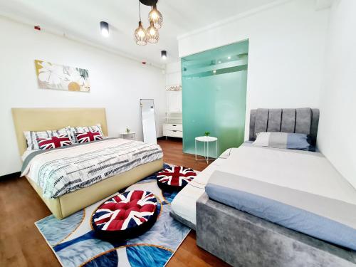 a bedroom with two beds and a rug at Bright 7 Guests Scott Garden Duplex 1 Room Old Klang Road, Taman Desa, Kuchai Lama, Bangsar South, Pearl Point, Mid Valley, Kuala Lumpur in Kuala Lumpur