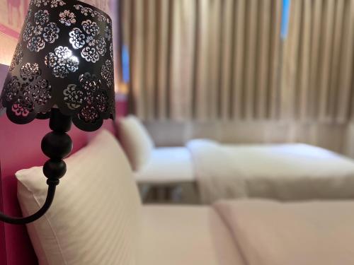 Postel nebo postele na pokoji v ubytování 191 Hotel