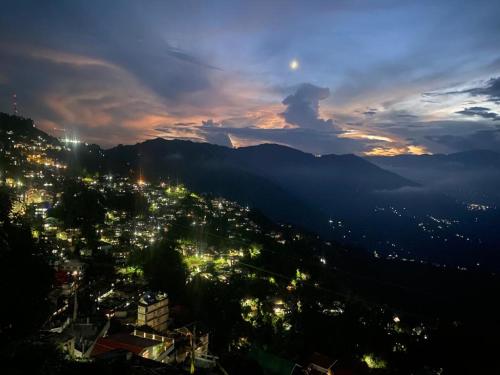 a view of a city at night at MAMTA HOMESTAY in Darjeeling