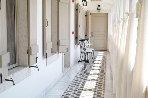 an empty hallway with black and white tiles on the floor at Viento Alacati Hotel in Alacati