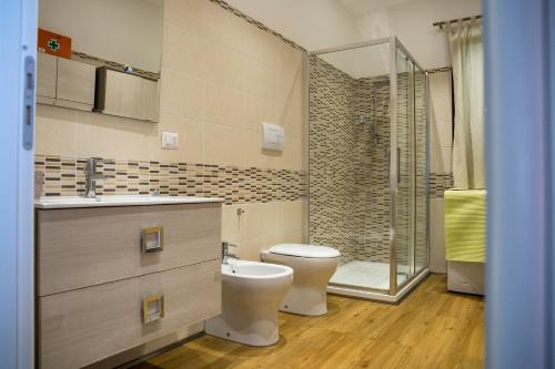 a bathroom with a toilet and a shower at La Terrazza di Cirico' in Carlentini