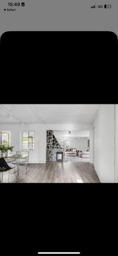 a living room with a table and a stone wall at Toarp Inn in Malmö