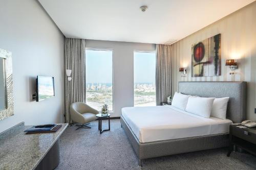 Ένα ή περισσότερα κρεβάτια σε δωμάτιο στο Grand Majestic Hotel Kuwait