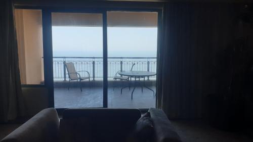 a living room with a view of a balcony at SAN STEFANO in Alexandria