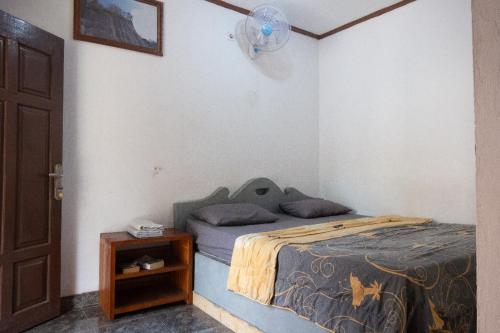 Ένα ή περισσότερα κρεβάτια σε δωμάτιο στο Gani Homestay