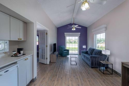 a kitchen and a living room with a couch at La Quinta Inn by Wyndham Kansas City Lenexa in Lenexa