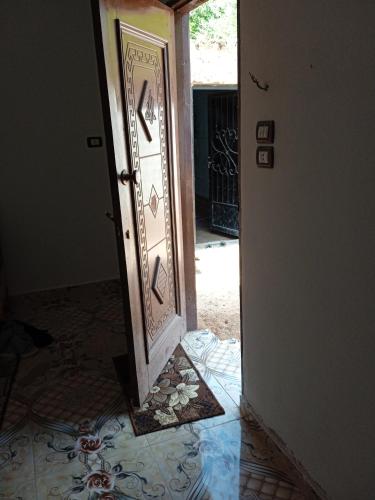 an open door with a mirror in a room at West view in Khuzām