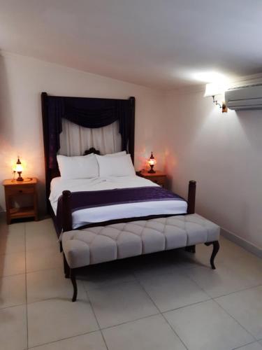 a bedroom with a large bed with two night stands at Central Park Otel - Adult Only in Dalyan