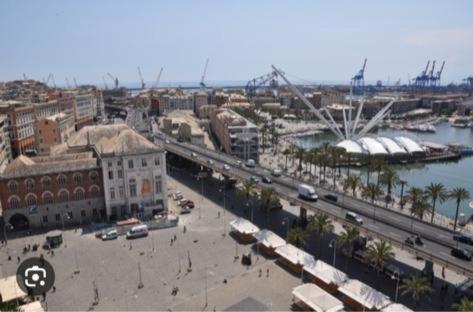 a view of a city with a harbor and a river at CasaBolla in Genova