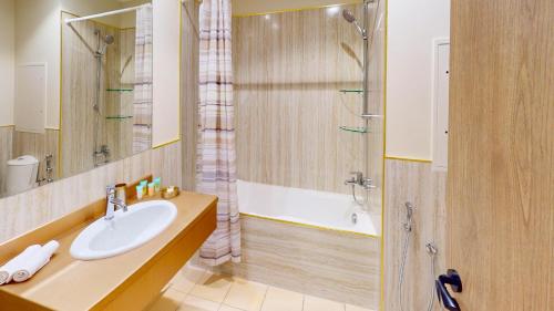 a bathroom with a sink and a shower at Amazing views Dubai eye & Palm in Dubai