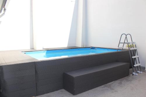 a jacuzzi tub in a room with a window at Casa dos Amigos - Arouca in Arouca