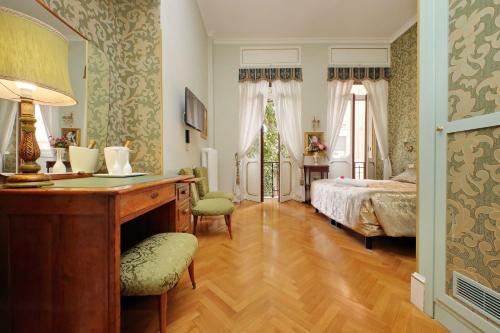 Postel nebo postele na pokoji v ubytování Domus Monamì Luxury Suites