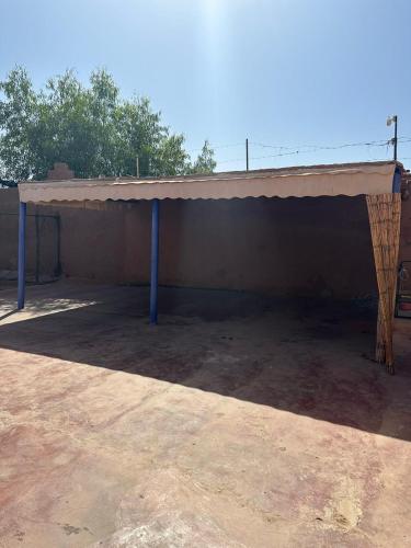 a large building with a roof on top of it at Villa Ms Holidays Mika privatisée Marrakech in Marrakech