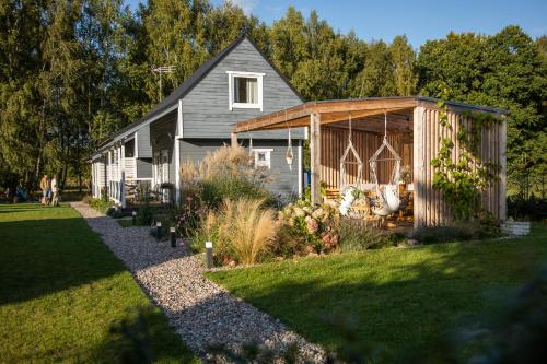 a house with a garden in the yard at Morski Klimat Sasino in Sasino