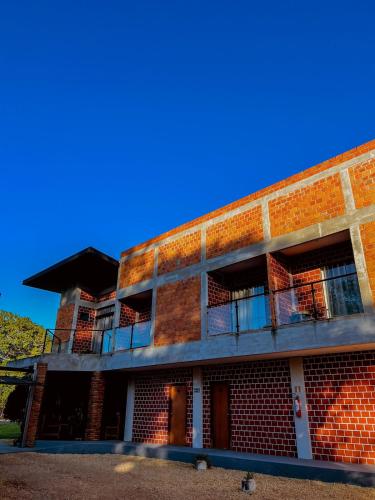 a brick building with balconies on the side of it at POUSADA MARTINS in Carolina