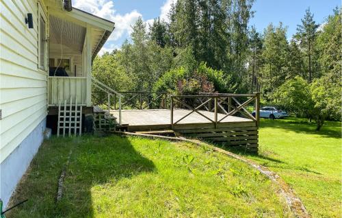 a deck on the side of a house at Amazing Home In Herräng With Wifi in Herräng