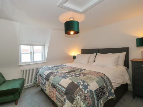 Ένα ή περισσότερα κρεβάτια σε δωμάτιο στο Mollys Cottage