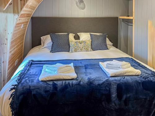 a bed with towels and pillows on it at Vale View - Uk43774 in South Barrow
