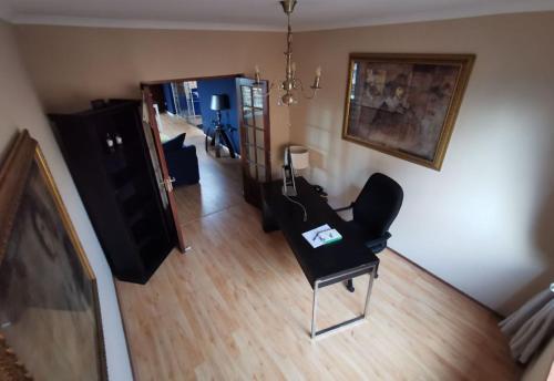 an aerial view of a living room with a chair at BellaBlues in Herolds Bay