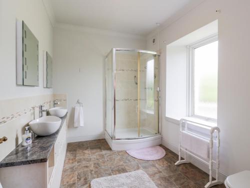 a bathroom with a shower and a sink at Shieldhill Farm House in Falkirk