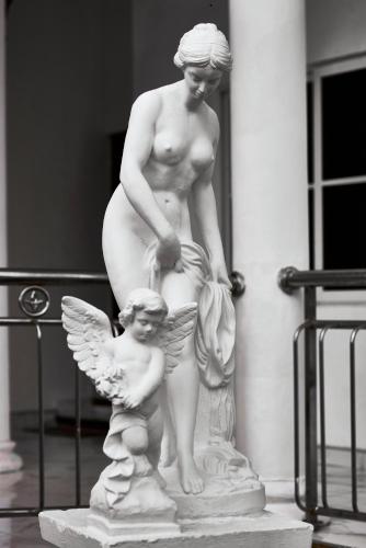 a statue of a nude woman and a child at The Peacock Mansion in Kumasi