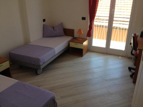Ένα ή περισσότερα κρεβάτια σε δωμάτιο στο Best Lavagna Apartment