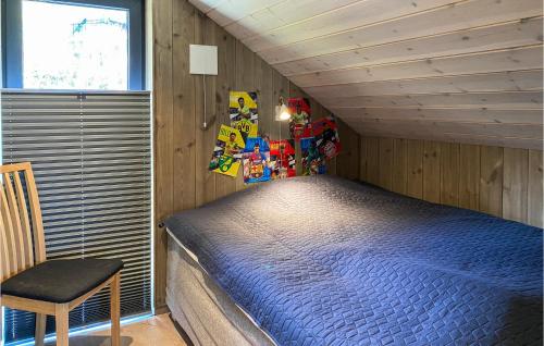 A bed or beds in a room at Gorgeous Home In Bjorli With House A Panoramic View
