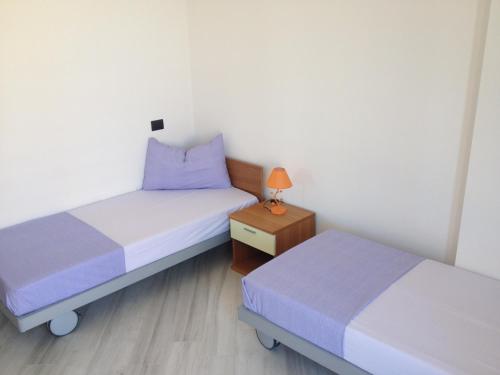 A bed or beds in a room at Best Lavagna Apartment