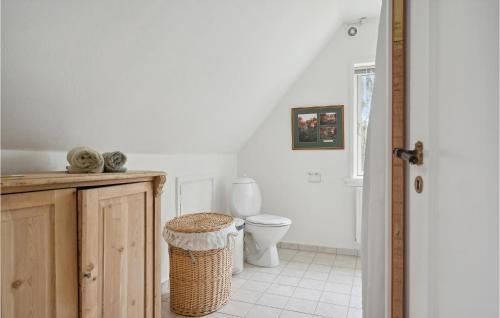 a bathroom with a toilet and a trash can at Beautiful Home In Faaborg With Wifi in Faaborg