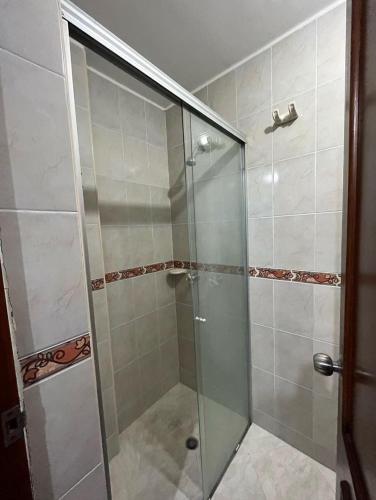 a shower with a glass door in a bathroom at HABITACION BAÑO PRIVADO - EXCELENTE UBICACION in Bucaramanga