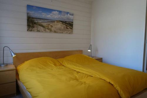 Ένα ή περισσότερα κρεβάτια σε δωμάτιο στο Vakantiewoning NOORDERSTEK