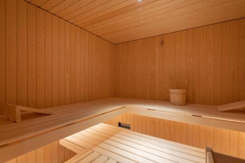 an inside of a sauna with a wooden floor at Melchtal Resort Apart Hotel in Melchtal