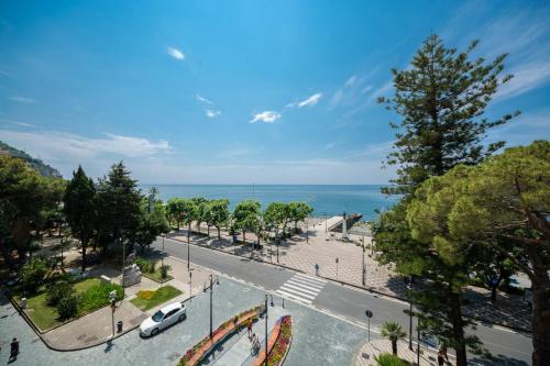 an aerial view of a street with trees and the ocean at Relais San Giacomo in Maiori
