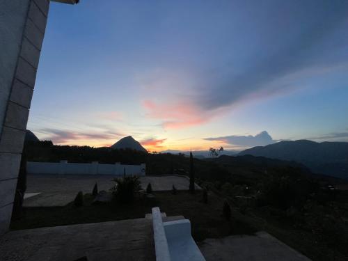 a view of a sunset from the roof of a building at Villa Venecia Colonial in Venecia