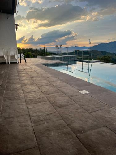 a swimming pool with a view of the mountains at Villa Venecia Colonial in Venecia