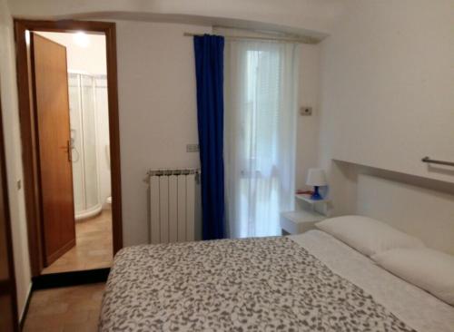 Ένα ή περισσότερα κρεβάτια σε δωμάτιο στο Appartamento Bellavista