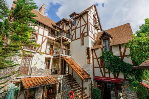 an old building in the french town of chateau de bourdain at Le Charcoa Hotel in Chiang Mai