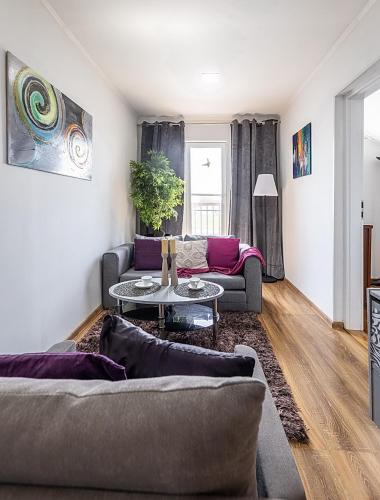 a living room with a couch and a table at Penzión Florens, Nesvady in Nesvady