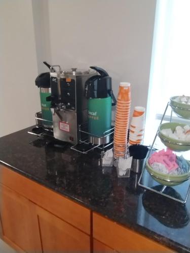 a kitchen counter with a coffee maker on it at Quality Inn & Suites Wilsonville in Wilsonville