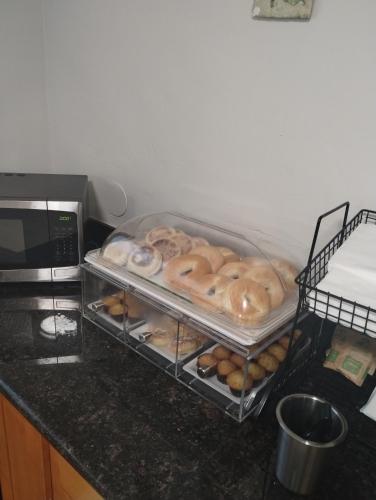 a bunch of donuts sitting on a kitchen counter at Quality Inn & Suites Wilsonville in Wilsonville
