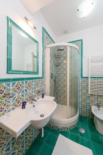 a bathroom with a sink and a shower at Relais San Giacomo in Maiori