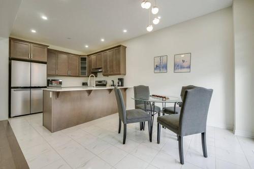 a kitchen with a table and chairs in a kitchen at 922 Logan Drive in Milton