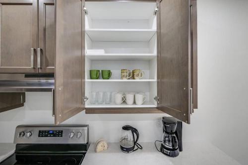 a kitchen with wooden cabinets and a stove top oven at 922 Logan Drive in Milton