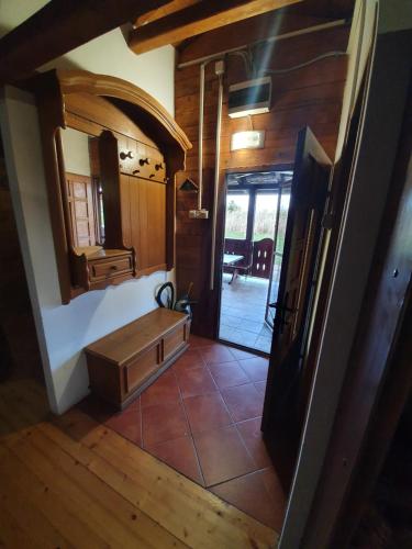 a hallway of a house with a sink and a mirror at Brvnara Lenka in Temerin