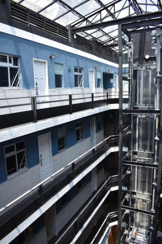 an empty building with a ladder in front of it at Continental Mexicano in Mexico City