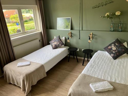 Postel nebo postele na pokoji v ubytování Hotel Restaurant In d'Ouwe Peel